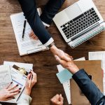 business-people-shaking-hands-together-3